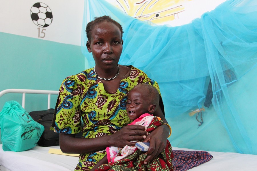 Kenyan mother with child at a hospital in Lodwar, Kenya