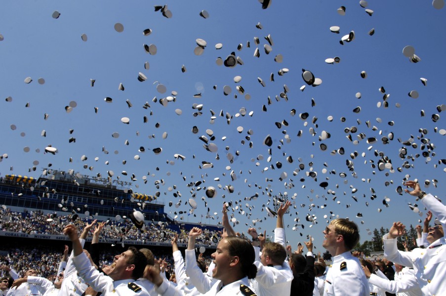 Traditional hat toss celebration at graduation from United States Naval Academy