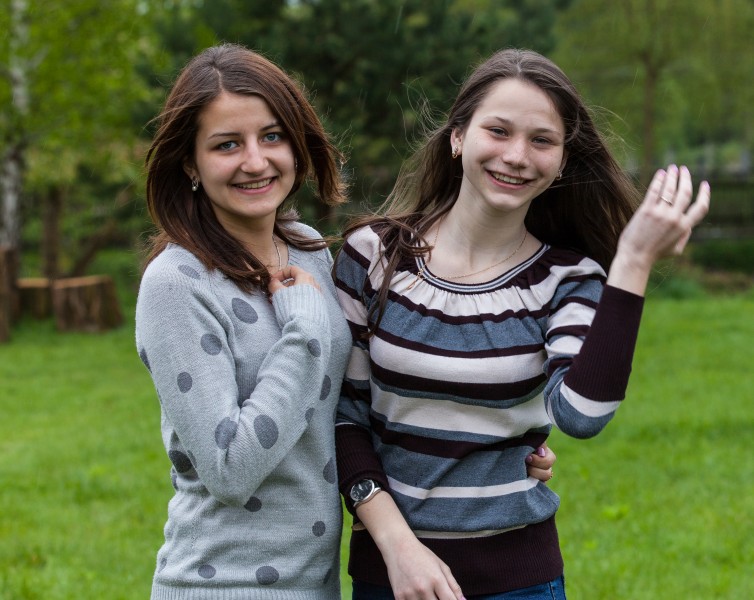 two charming brunette girls photographed in a Catholic recollection and recreation center in May 2014, picture 2/6