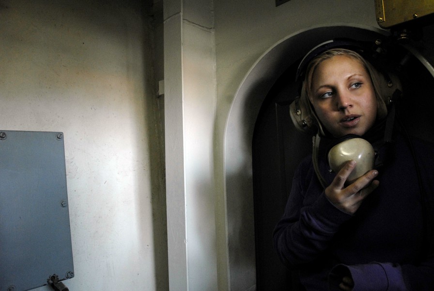 US Navy 071105-N-4776G-279 Aviation Boatswain's Mate (Fuel) Airman Amber Punkwitz uses a sound powered telephone during a refueling at sea aboard Nimitz-class aircraft carrier USS Ronald Reagan (CVN 76)