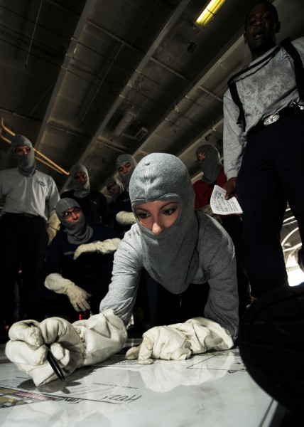 US Navy 080620-N-9898L-050 Yeoman 1st class Julie Eubanks trains in damage control plotting during a general quarters drill aboard Nimitz-class aircraft carrier USS Abraham Lincoln (CVN 72)