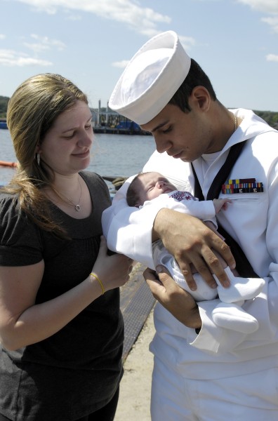 US Navy 080821-N-8467N-013 Robert Rojas holds his 2-week-old daughter for the first time
