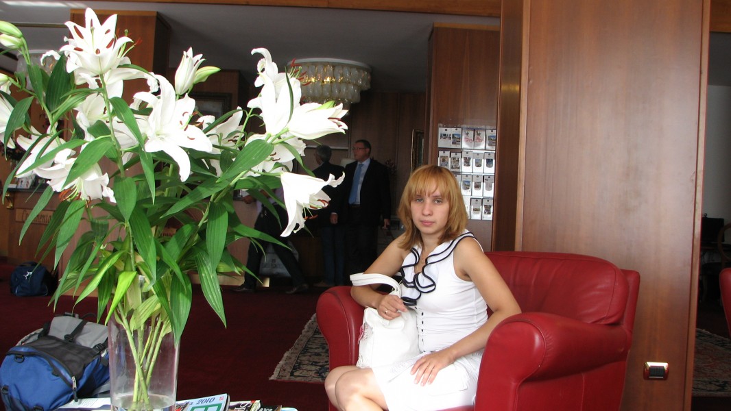 A young women in a hotel lobby, near Venice, picture 1.