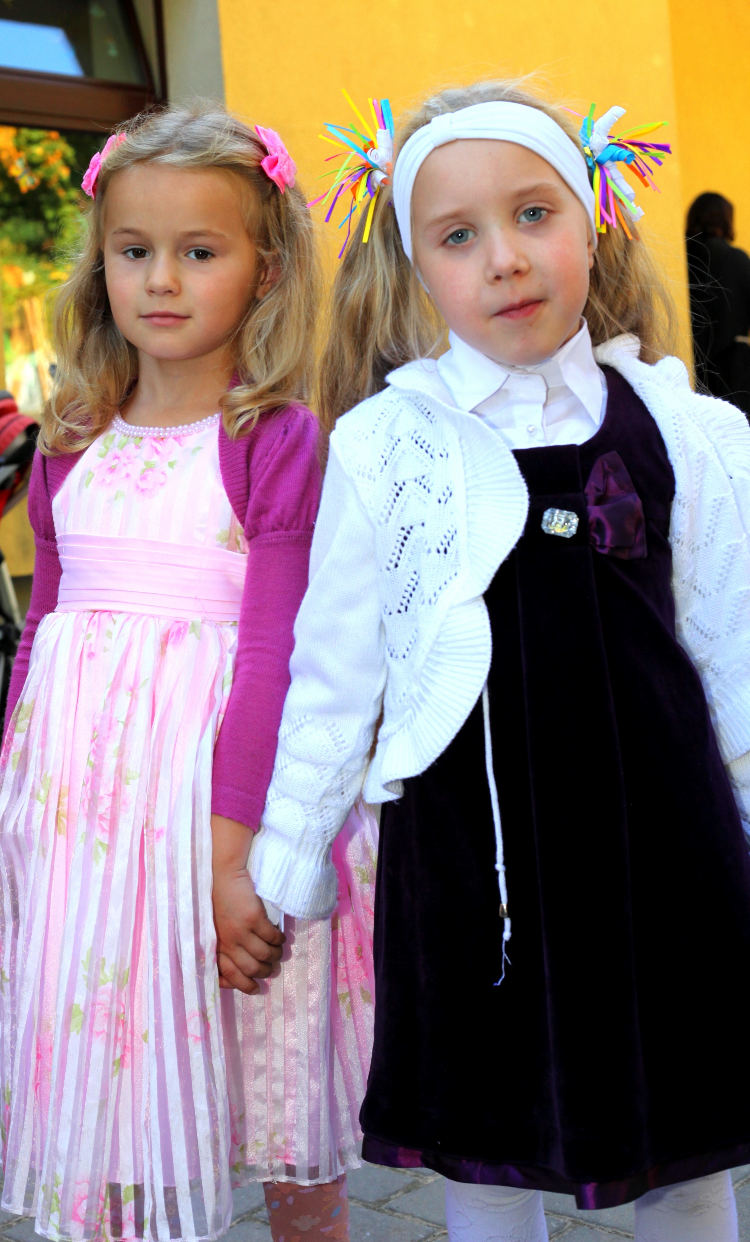 two Catholic child girls near a Church after the Holy Mass, photo 2