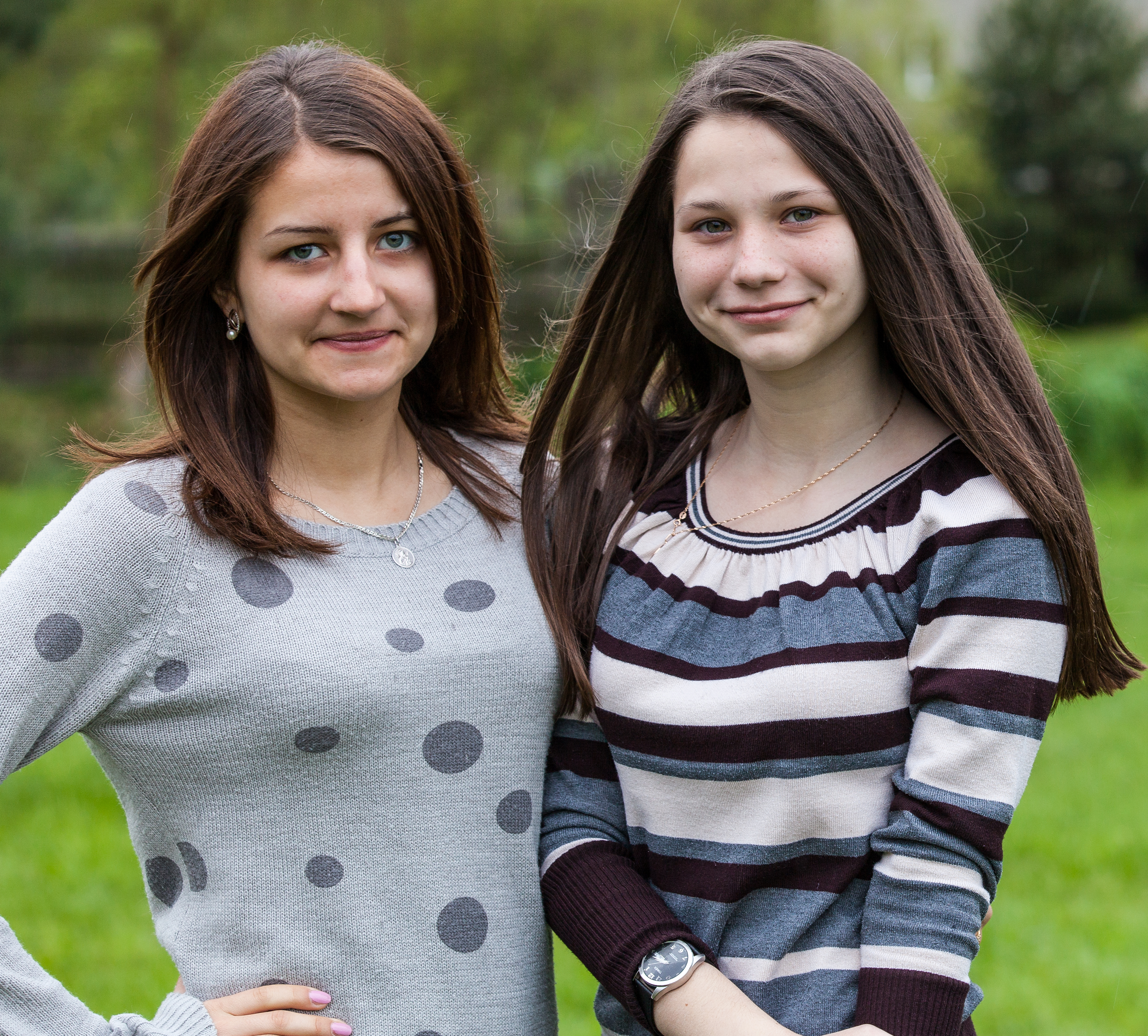 two charming brunette girls photographed in a Catholic recollection and recreation center in May 2014, picture 1/6