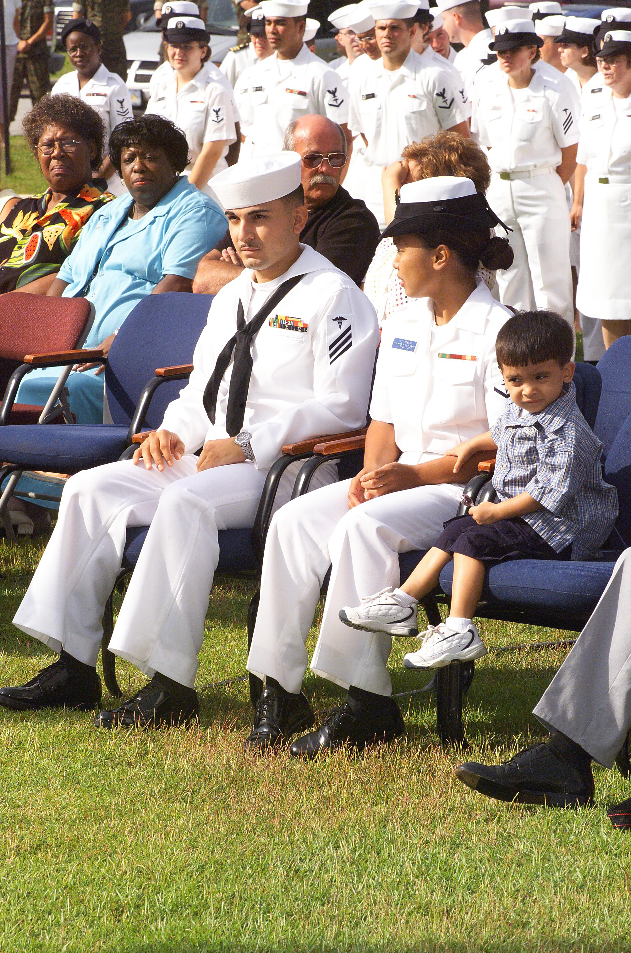 US Navy 040811-N-0000N-005 Hospitalman Apprentice Luis E. Fonseca, Jr., sits with his family