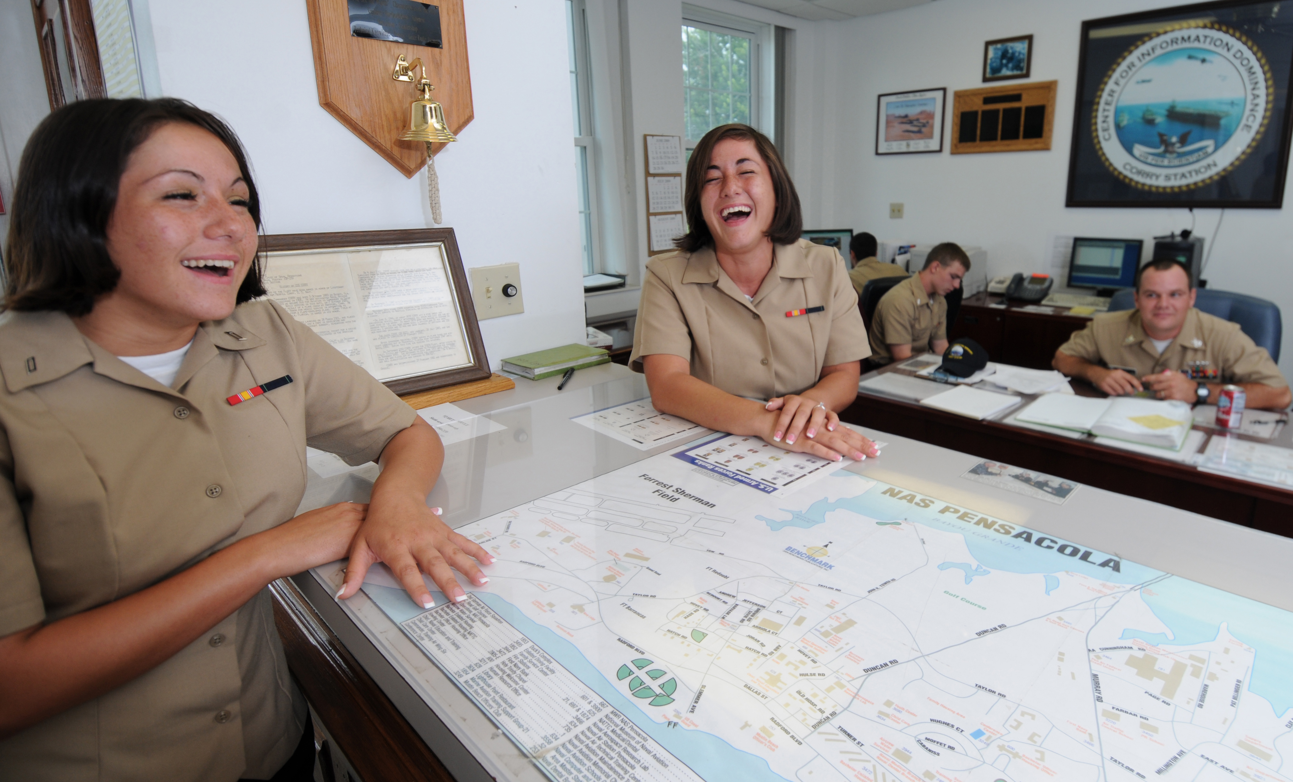 US Navy 090723-N-5328N-059 Identical twins Seaman Elyssa Valentine, left, and Seaman Ashley Valentine share a laugh in the main quarterdeck at Center for Information Dominance (CID) Corry Station