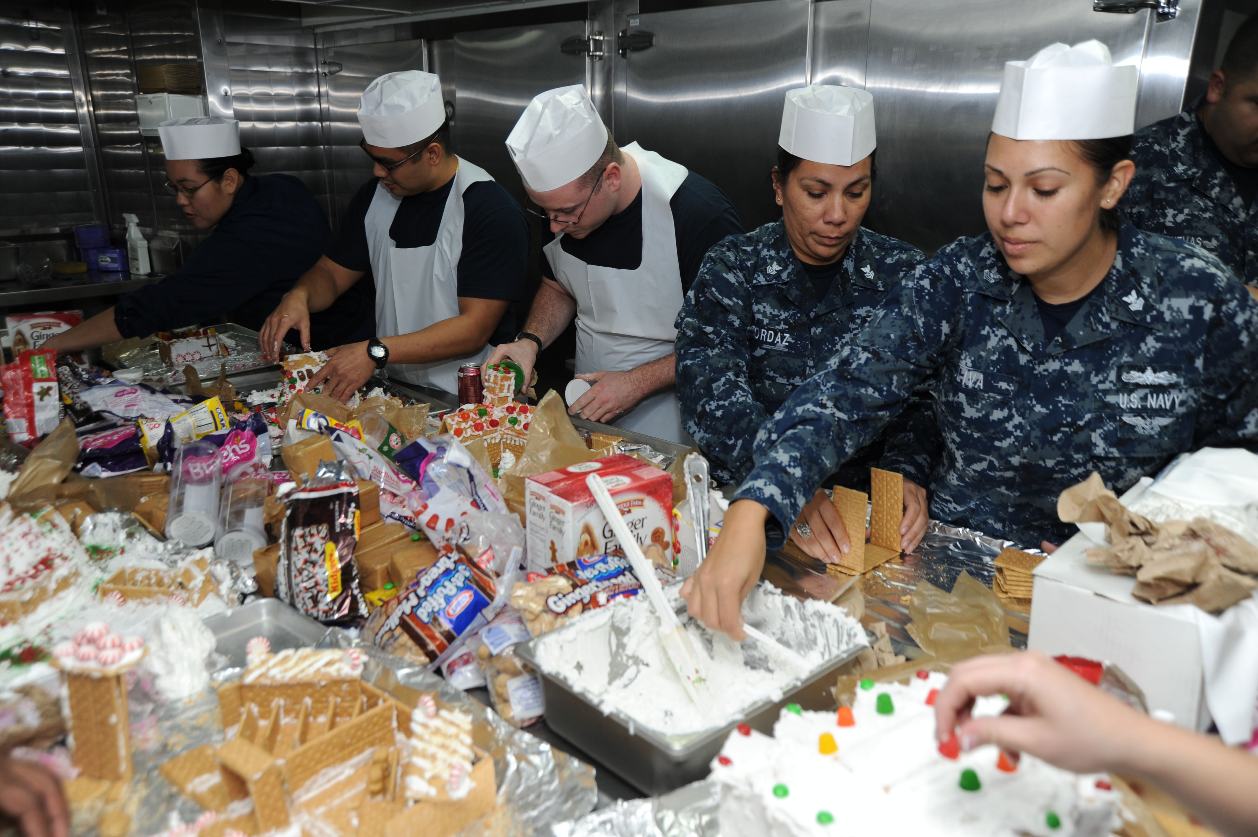 US Navy 111216-N-UE944-005 Sailors participate in a gingerbread house-building contest sponsored by the morale, welfare, and recreation department 