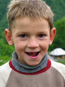 Ruthenian boy at the hillfort Obcina Poienile de sub Munte / MaramureЕџ Mountains (Inner Eastern Carpathians) in north of Rumania / EU.
