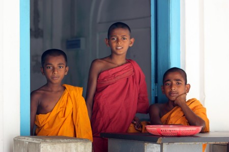 Three of the temple novices at the Koth Duwa temple, on the Maduganga in Sri Lanka.