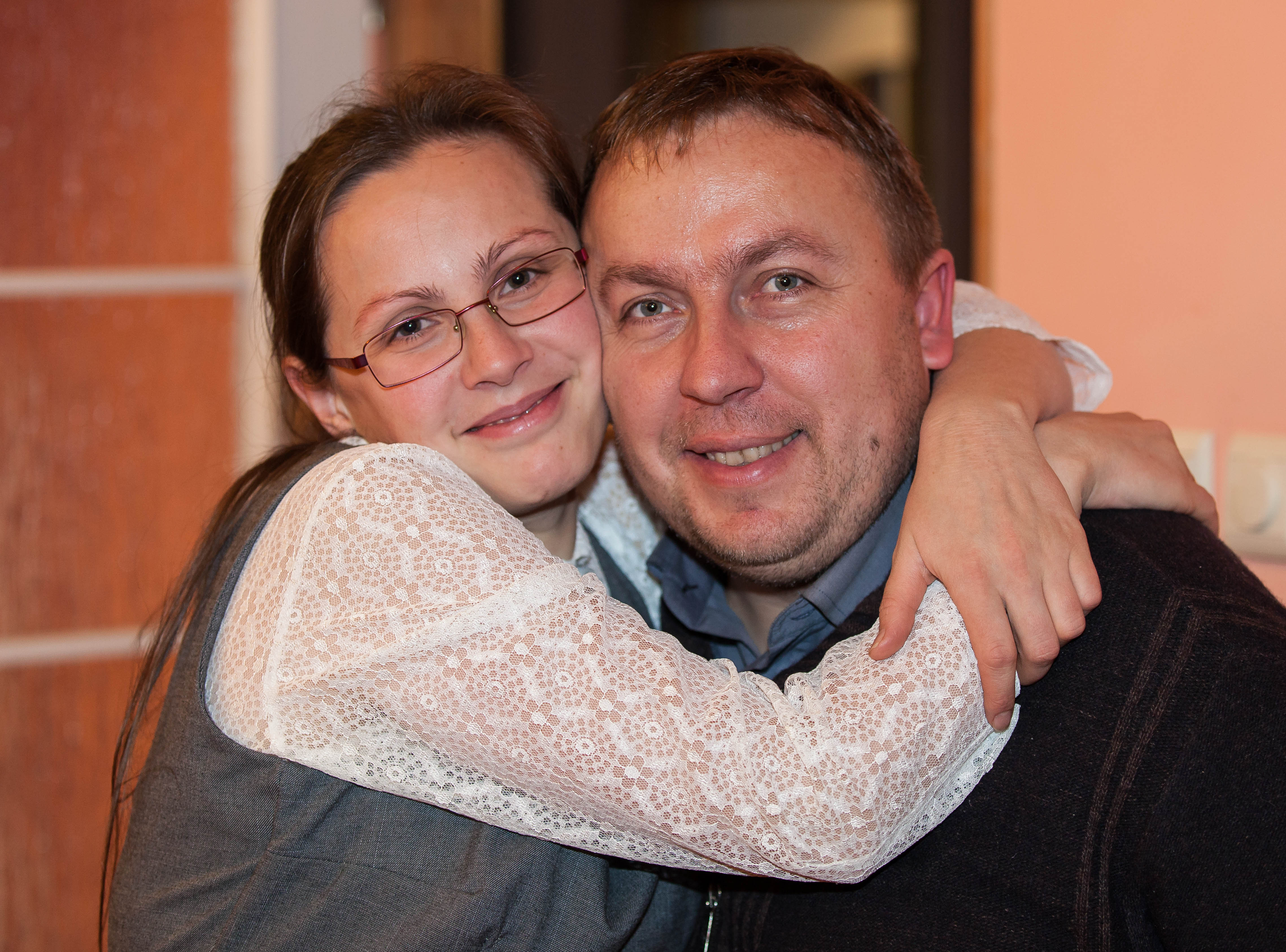 a Catholic wife hugging her husband in December 2013