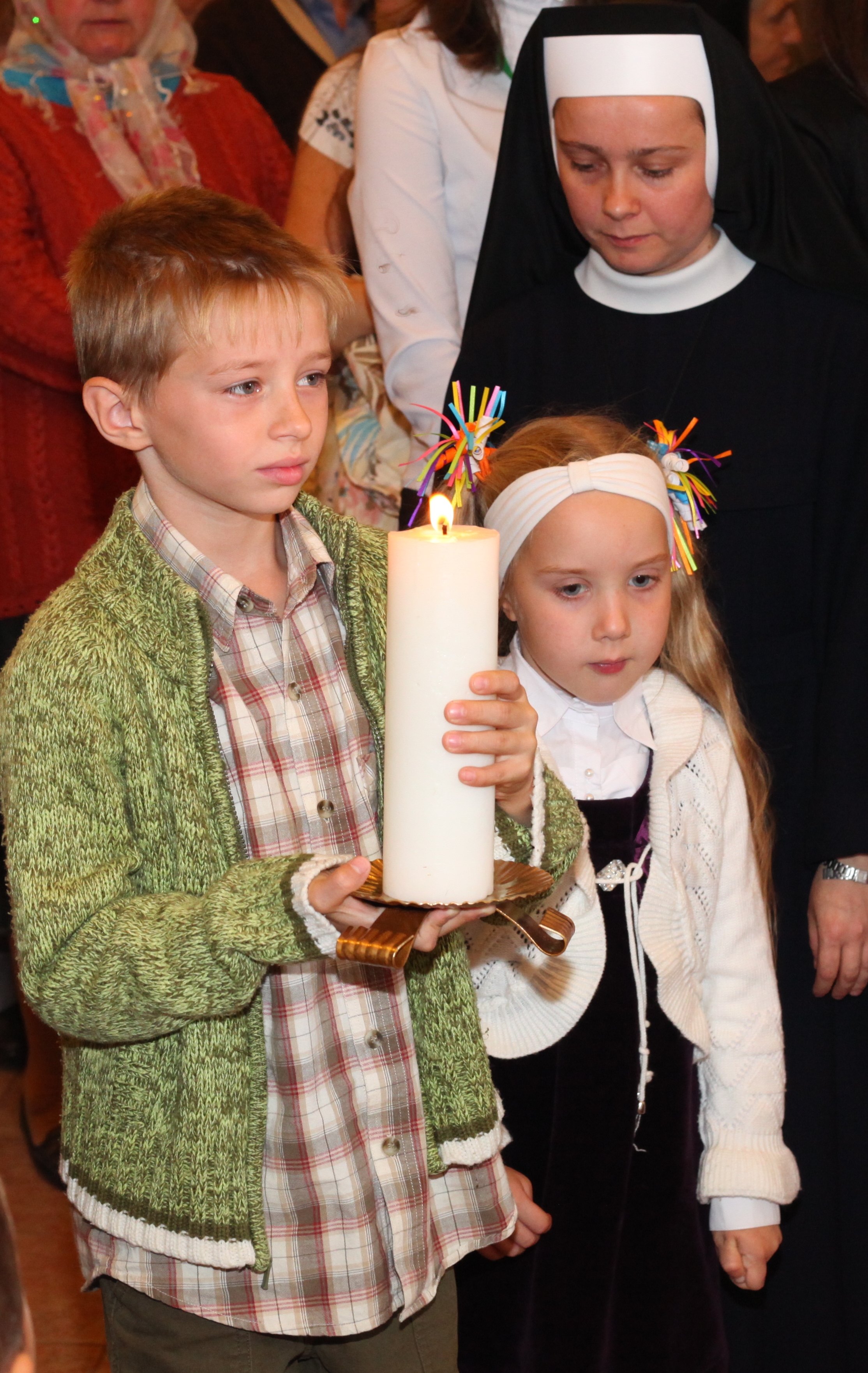 Catholic children at a Holy Mass