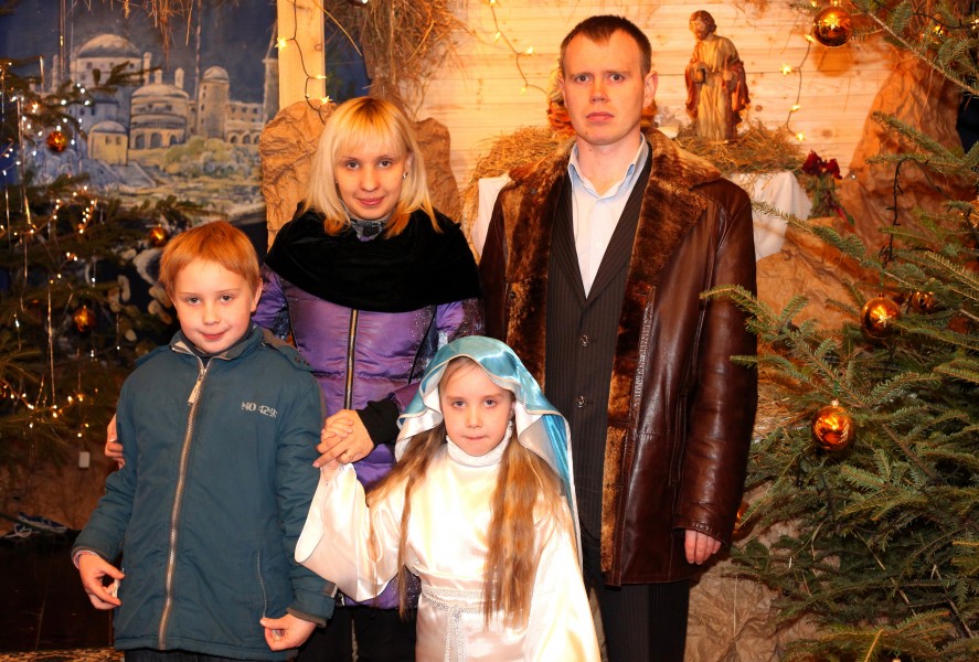 a Catholic family in a Church during the Christmas time, photo 2