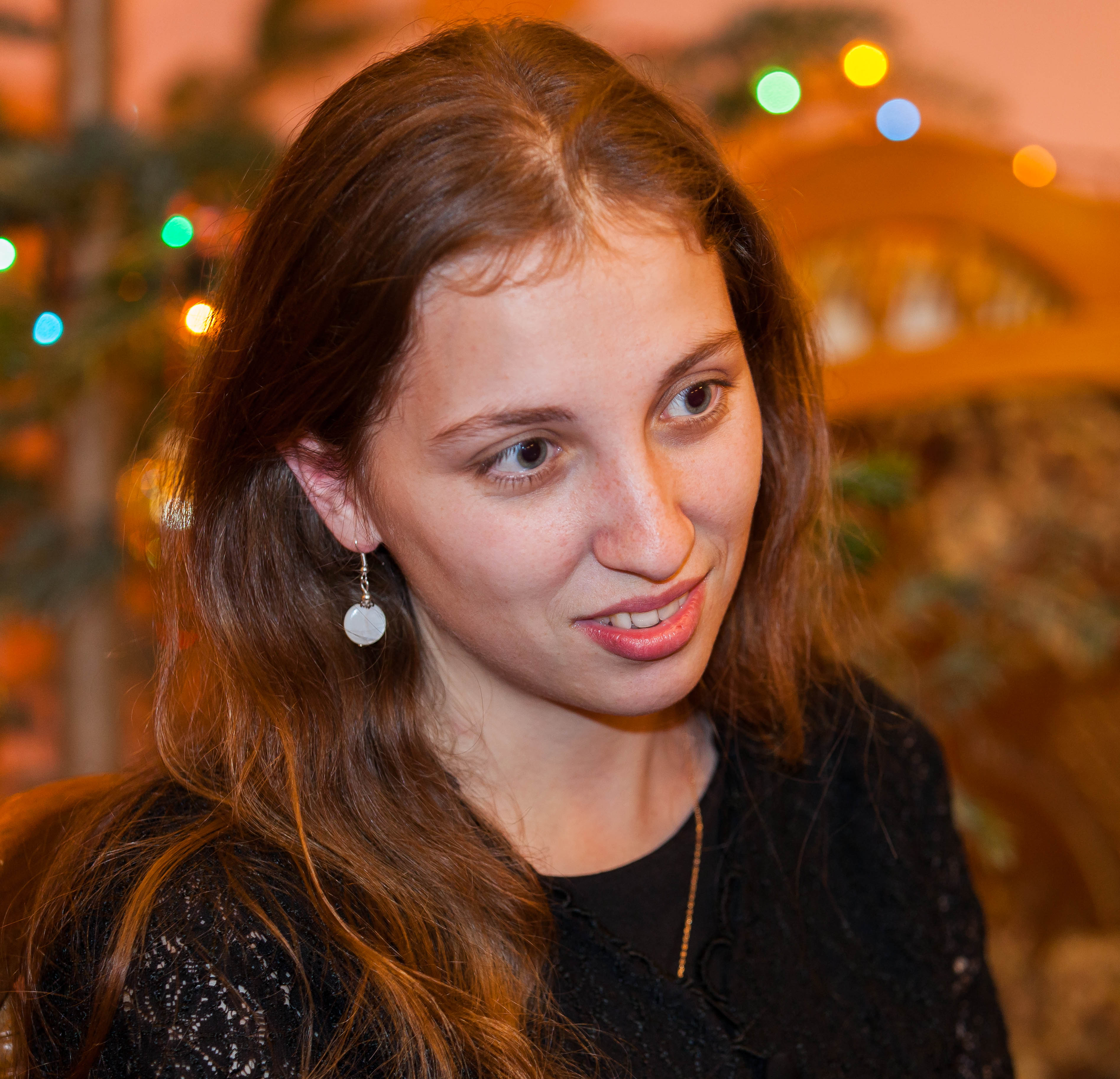 a young attractive Catholic woman photographed in December 2013, portrait 3/4