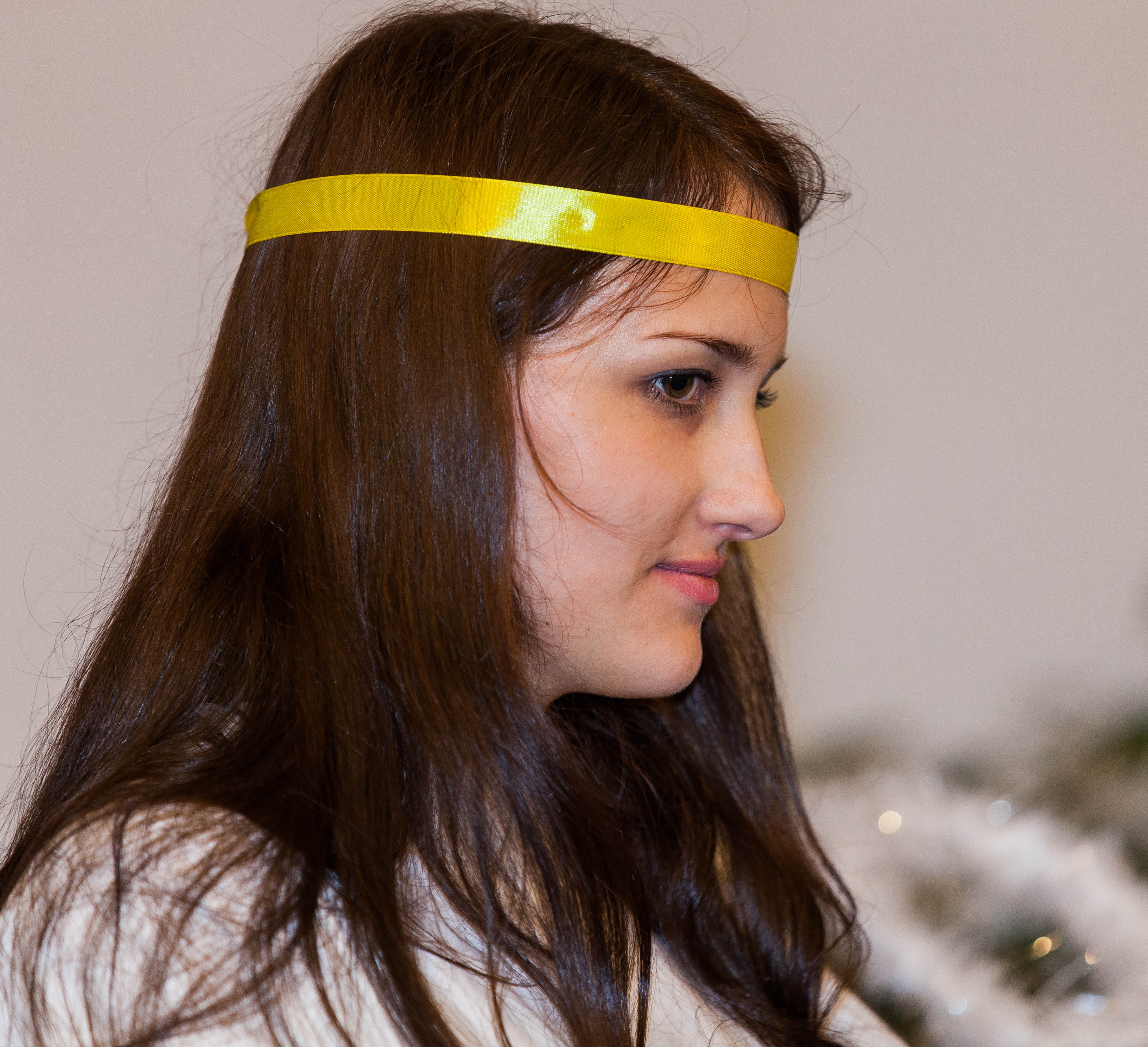 a young brunette Catholic woman in a church photographed in December 2013, picture 5