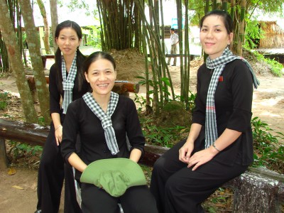 Female guards in Vietcong guerrilla garb, Cu Chi Tunnels site, near Ho Chi Minh City, Vietnam. July 2009.