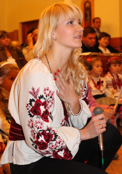 an amazingly charming and tender beautiful young blond Catholic woman in a Church, photo 15