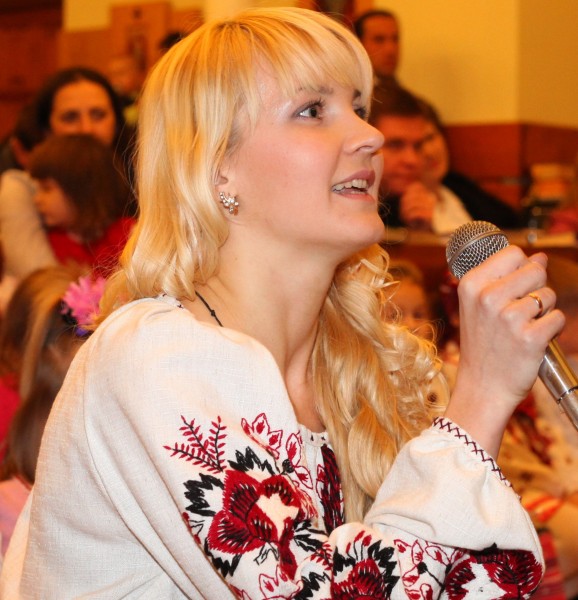 an amazingly charming and tender beautiful young blond Catholic woman in a Church, photo 18