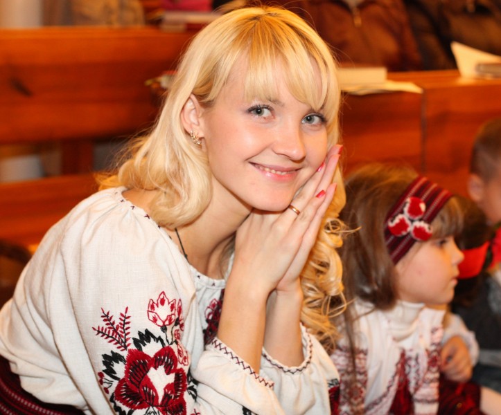 an amazingly tender and charming beautiful young blond smiling Catholic woman in a Church, photo 19