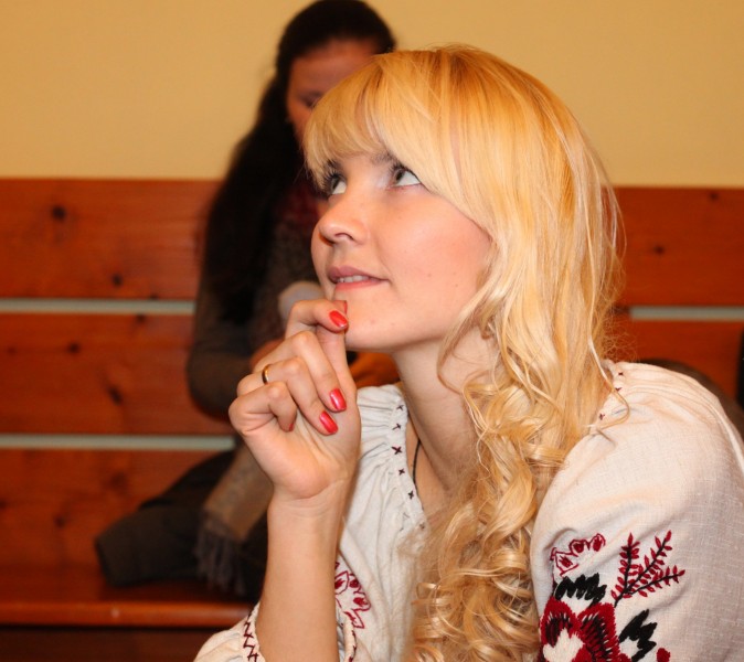 an amazingly tender, feminine and charming, beautiful young blond Catholic woman in a Church, photo 20
