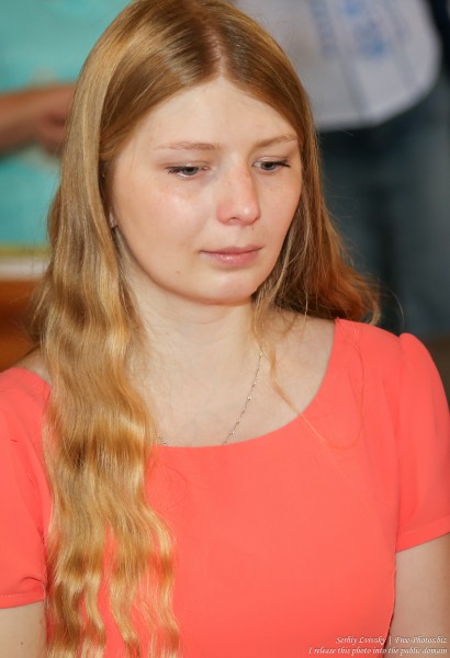 a young blond woman in a Catholic church in July 2016, picture 2