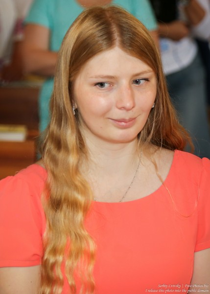 a young blond woman in a Catholic church in July 2016, picture 3