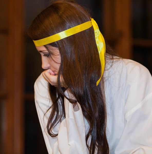 a young brunette Catholic woman in a church photographed in December 2013, picture 6