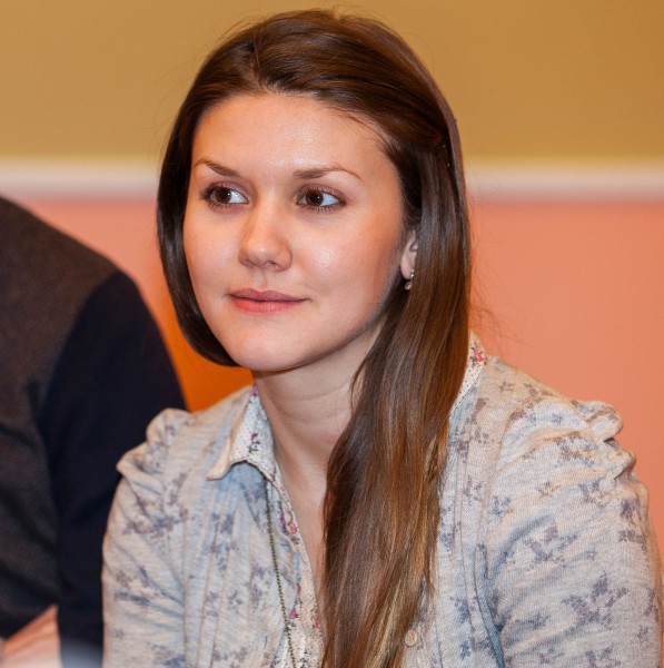 a young brunette Catholic woman photographed in December 2013, picture 10/11