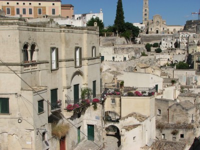 Free photo of Matera town, Italy. Matera preserves a large and diverse collection of buildings related to the Christian faith, including a large number of rupestrian churches carved from the soft volcanic rock of the region. These churches, which are also found in the neighboring region of Puglia, were listed in the 1998 World Monuments Watch by the World Monuments Fund.<br>Name of photo's author: Free-Photos.biz<br>This photo was taken in: Matera, Italy