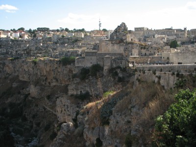 Free photo of Matera town, Italy. Matera preserves a large and diverse collection of buildings related to the Christian faith, including a large number of rupestrian churches carved from the soft volcanic rock of the region. These churches, which are also found in the neighboring region of Puglia, were listed in the 1998 World Monuments Watch by the World Monuments Fund.<br>Name of photo's author: Free-Photos.biz<br>This photo was taken in: Matera, Italy