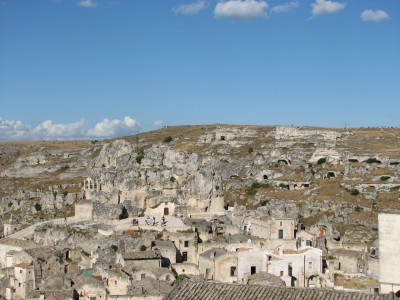 Free photo of Matera town, Italy. Matera preserves a large and diverse collection of buildings related to the Christian faith, including a large number of rupestrian churches carved from the soft volcanic rock of the region. These churches, which are also found in the neighboring region of Puglia, were listed in the 1998 World Monuments Watch by the World Monuments Fund.<br>Name of photo's author: Free-Photos.biz<br>This photo was taken in: Matera, Italy