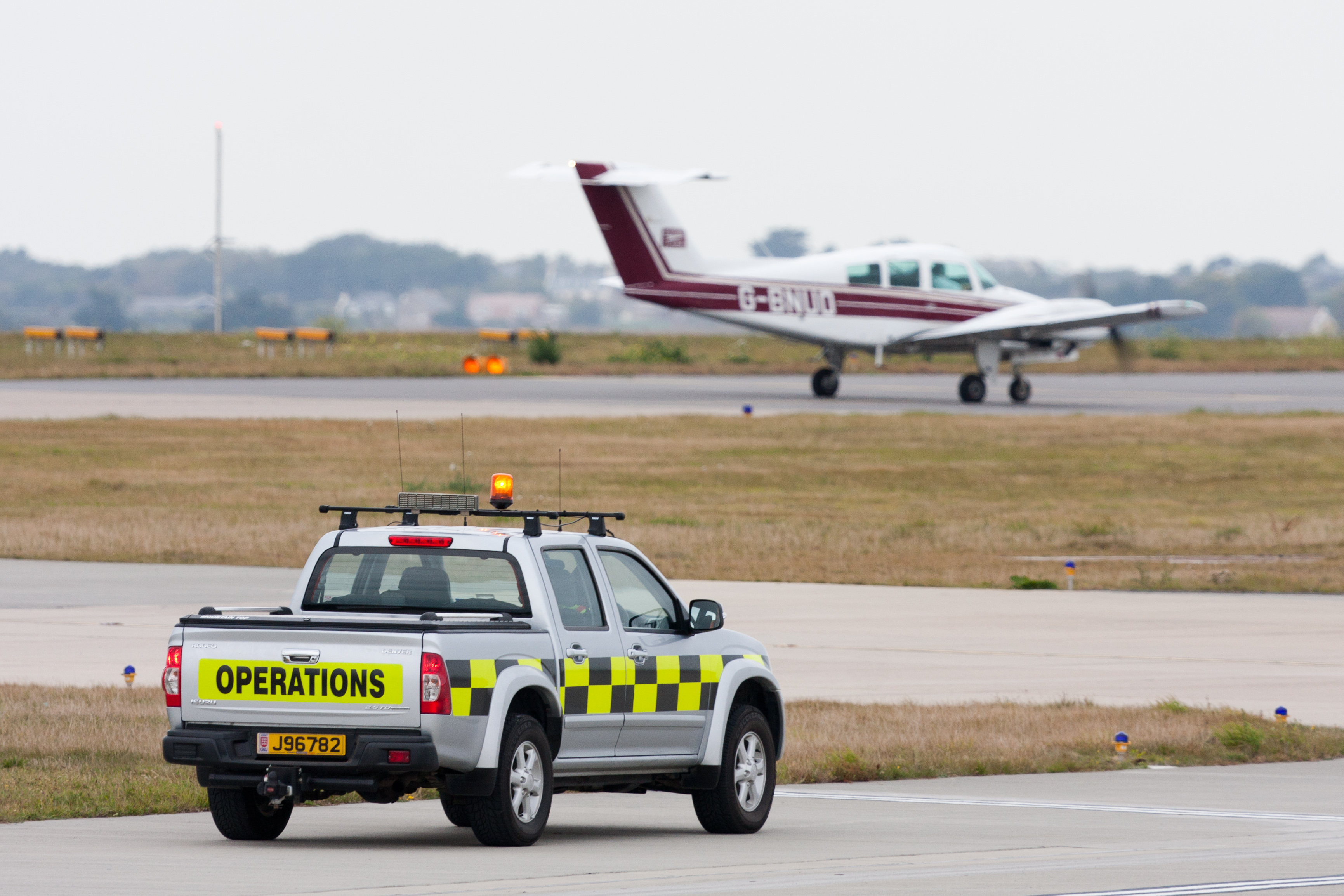 Jersey Airport operations vehicle and aircraft
