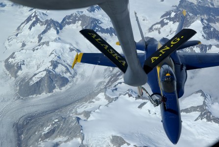 A U.S. Air Force Boeing KC-135R Stratotanker from the 168th Air Refueling Wing, Alaska Air National Guard, refuels a U.S. Navy McDonnell Douglas F/A-18A Hornet from the Navy's Blue Angels on its way from an air show at Elmendorf Air Force Base, Alaska (USA), on 14 August 2006.