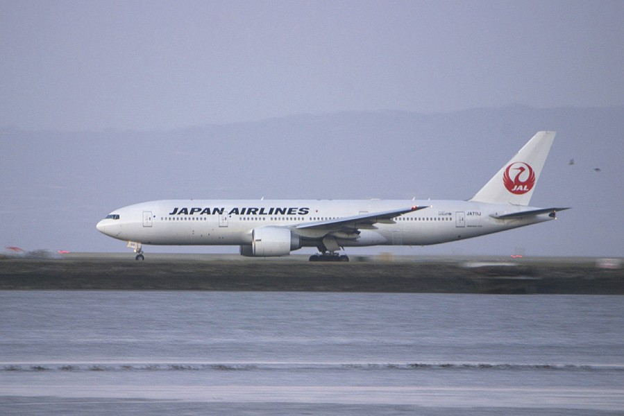 Boeing 777-200 JAL accelerating... passing birds... thank you, Nikon! (8500306928)