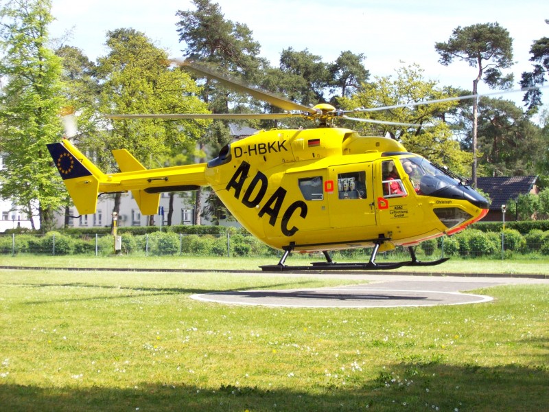Helicopter BK 117 taking off from university clinic helipad in Bonn