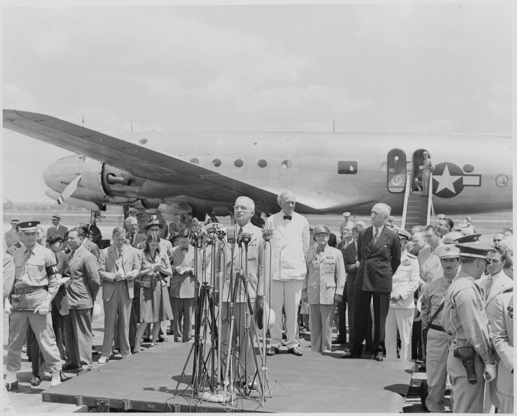 Photograph of President Truman speaking at the airport ceremony marking the departure of Secretary of State James... - NARA - 199409