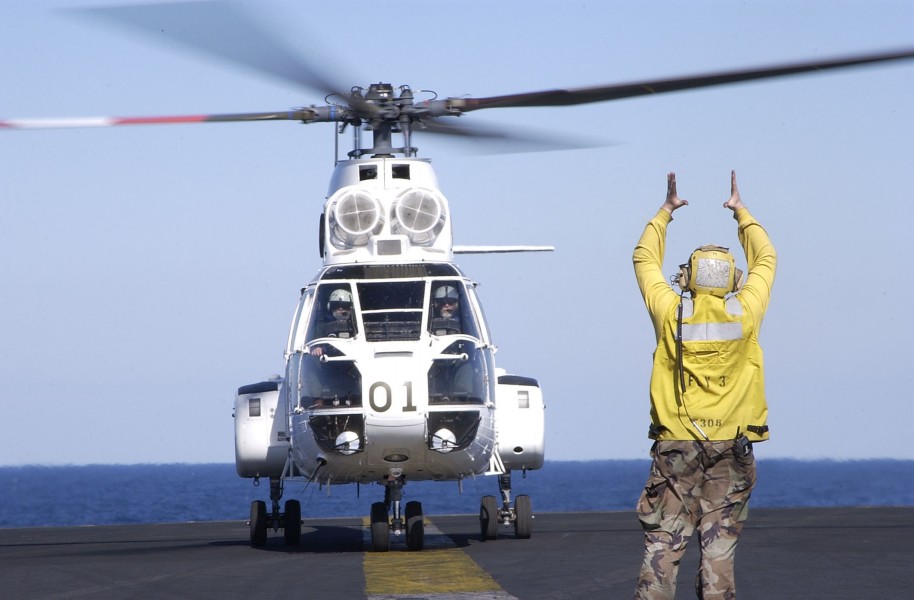 US Navy 030326-N-4308O-015 An SA-332 Super Puma helicopter is given the signal to lift off of the flightdeck of USS Harry S. Truman (CVN 75