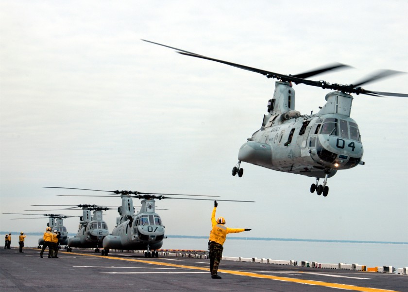 US Navy 041118-N-7506R-003 Flight deck personnel launch Marine CH-46 Sea Knight helicopters aboard USS Kearsarge (LHD 3)