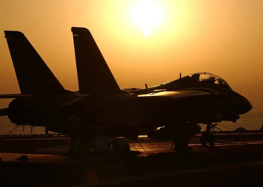 US Navy 050323-N-6363M-001 The sun sets behind an F-14B Tomcat assigned to the Swordsmen of Fighter Squadron Three Two (VF-32) on the flight deck aboard USS Harry S. Truman (CVN 75)