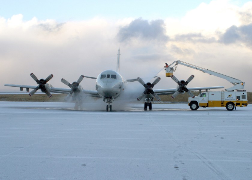 US Navy 061108-N-3013W-039 An Icelandic de-icing crew working for Keflavik International Airport sprays down the surface of a P3-C Orion before a flight
