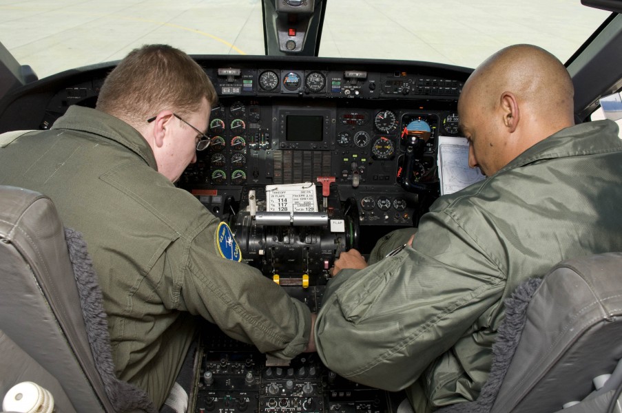 US Navy 090219-N-9552I-030 Naval Aircrewmen 1st Class Troy Rudisill and David Williams conduct pre-flight checks in the cockpit of a Gulfstream C-20A-G III
