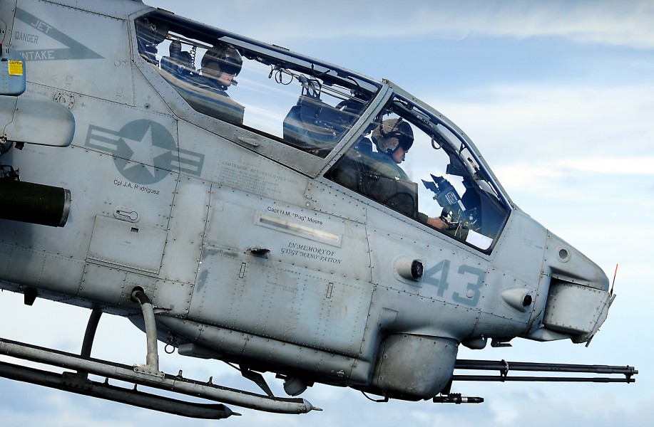 US Navy 100617-N-7948R-125 Marine pilots assigned to the 15th Marine Expeditionary Unit (15th MEU) fly an AH-1W Super Cobra during flight operations aboard the amphibious assault ship USS Peleliu (LHA 5)