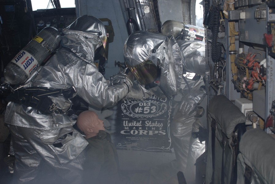 US Navy 100619-N-3358S-024 Sailors perform a simulated rescue inside a CH-53E Super Stallion helicopter during a fire drill aboard the amphibious transport dock ship USS Mesa Verde (LPD 19)