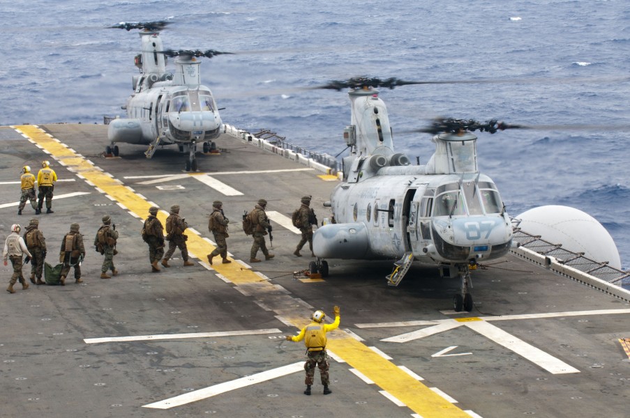 US Navy 111002-N-KM175-161 Marines assigned to the 31st Marine Expeditionary Unit (31st MEU) board CH-46E Sea Knight helicopters assigned to Marine