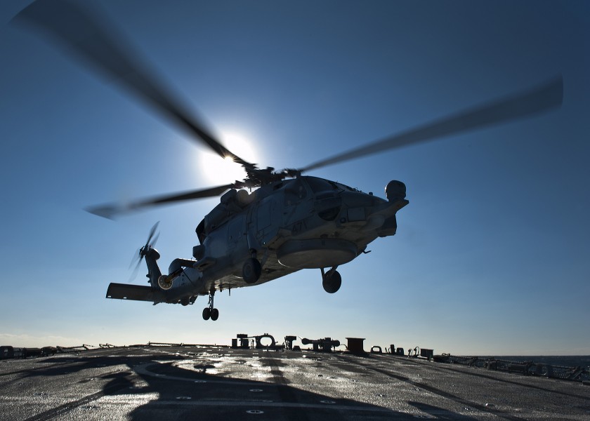 US Navy 111208-N-FI736-126 A helicopter lands aboard a ship