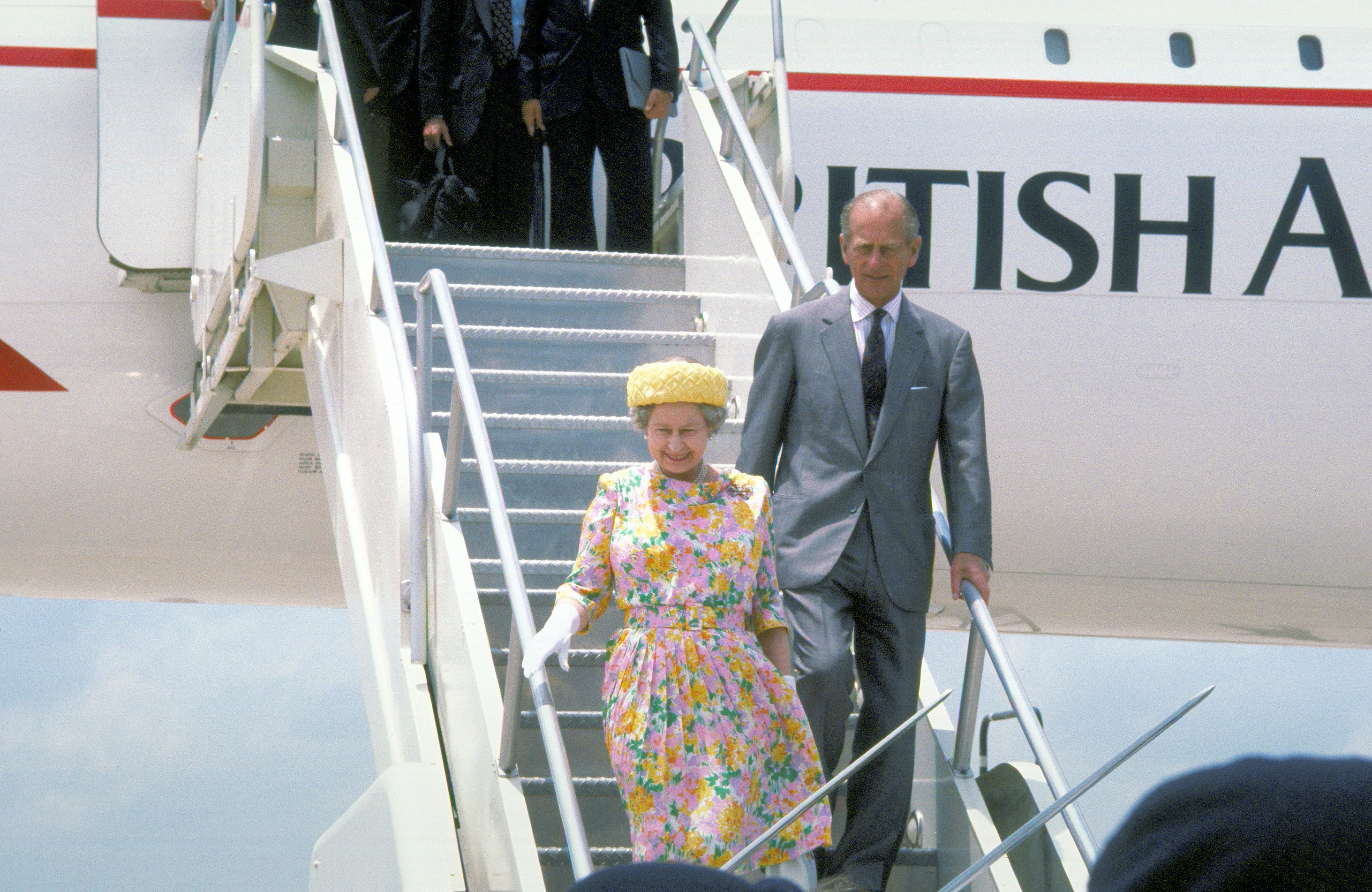 Queen Elizabeth II and Prince Philip disembark from a British Airways Concorde