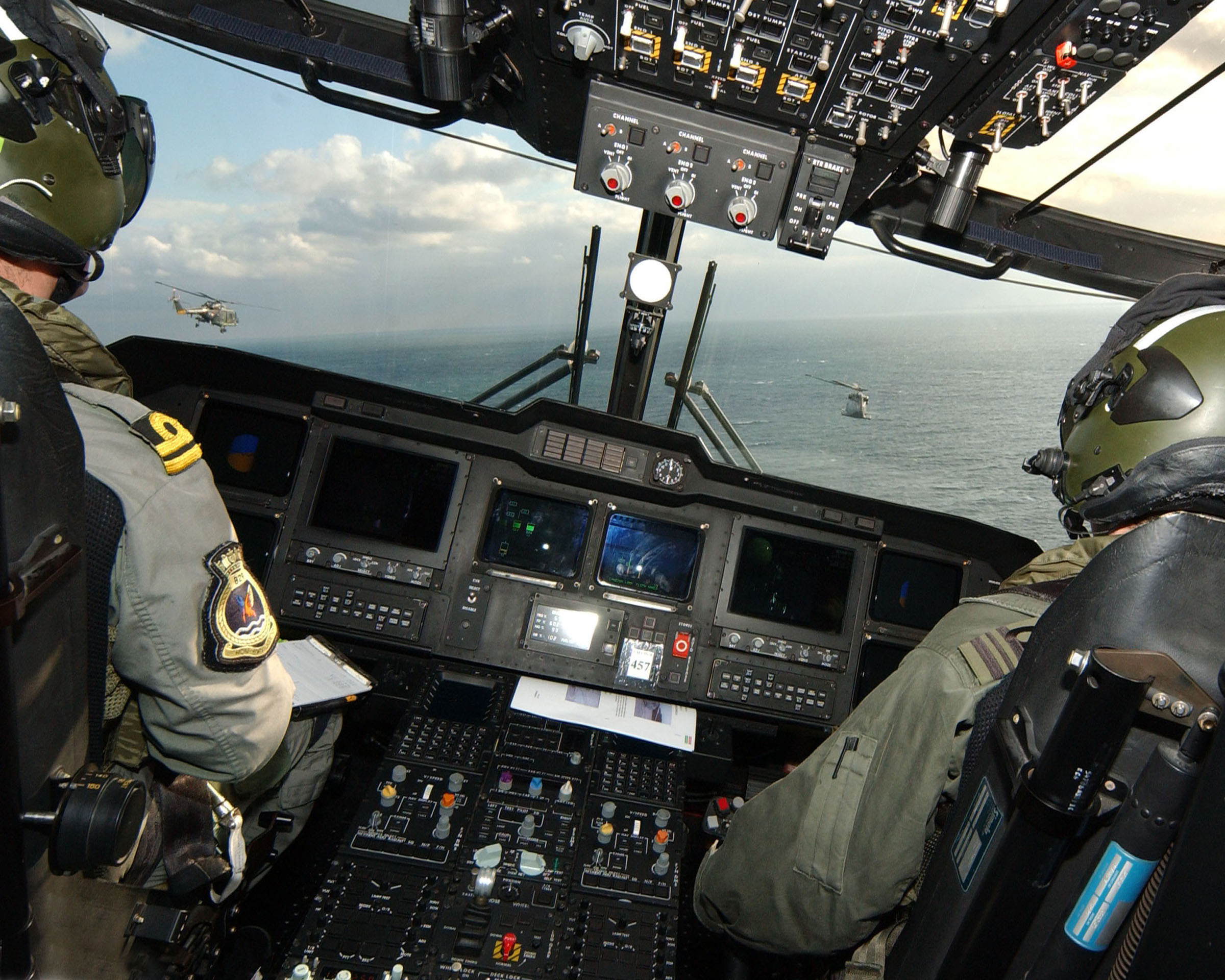 Two Dutch Naval Lynx helicopters were pictured from the cockpit of a Royal Naval Merlin helicopter of 829 Naval Air Squadron, based at RNAS Culdrose, during HMS Northumberland's family day 2005. MOD 45145976