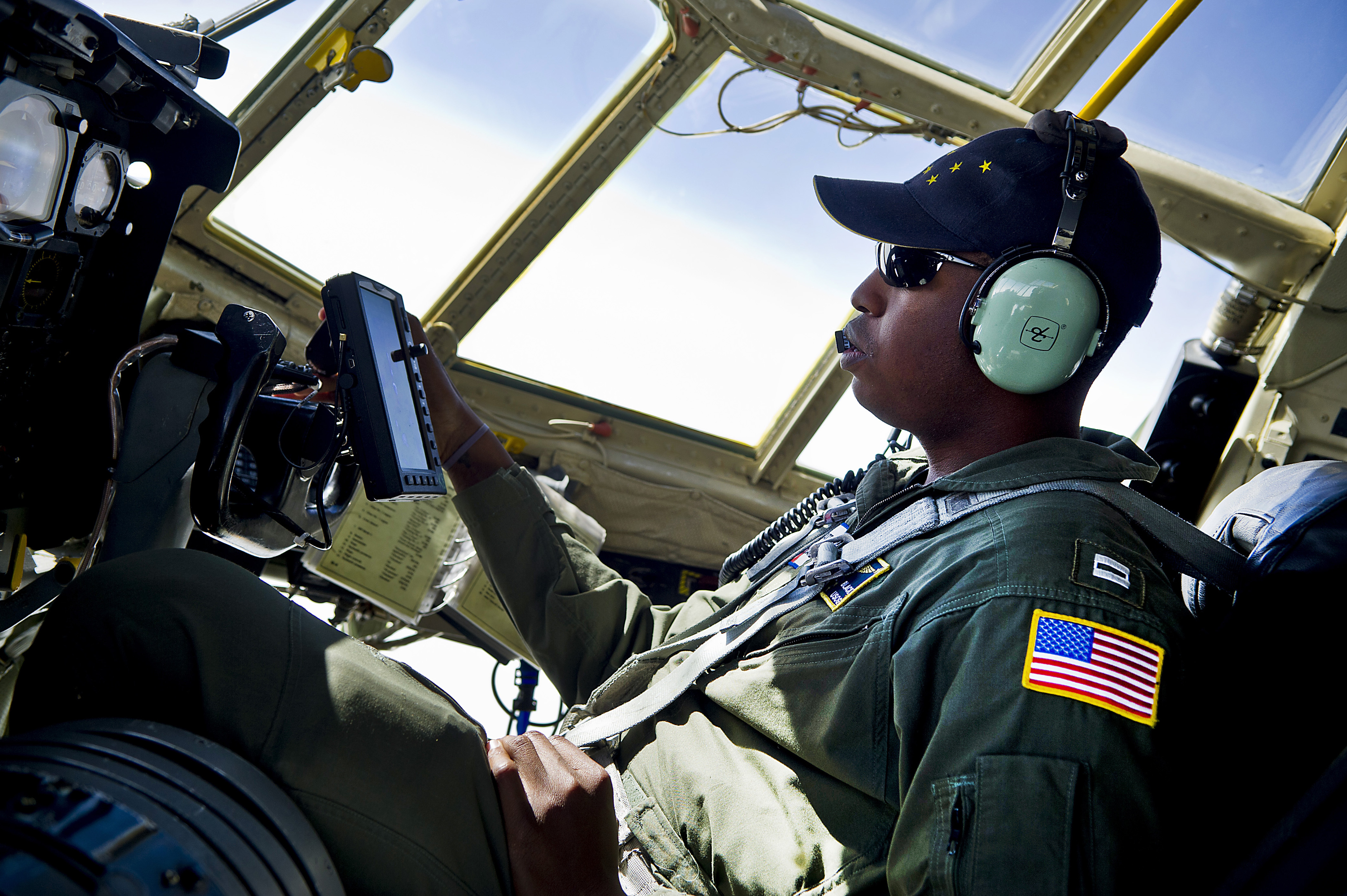 U.S. Coast Guard Lt. Randall Black, an HC-130H Hercules aircraft pilot, flies to Barrow, Alaska, June 28, 2012 120628-F-MQ656-259