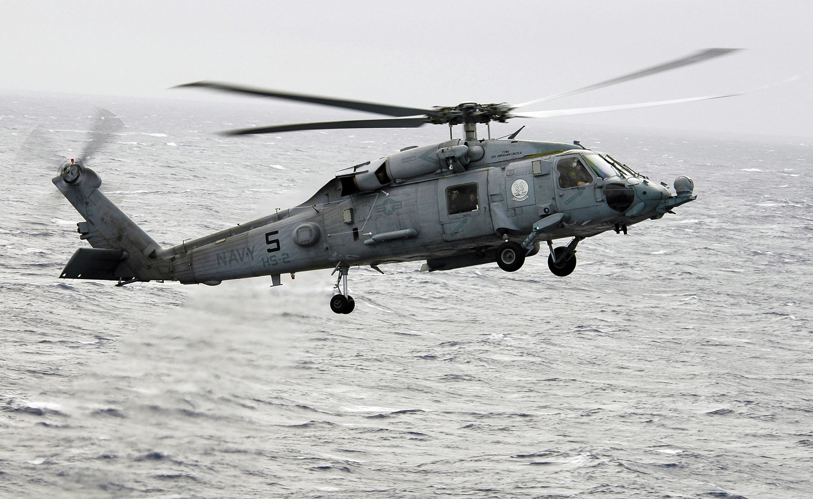 US Navy 060310-N-4166B-027 A SH-60F Seahawk helicopter assigned to Helicopter Anti-Submarine Squadron Two (HS-2) flies toward the Nimitz-class aircraft carrier USS Abraham Lincoln (CVN 72) for a landing