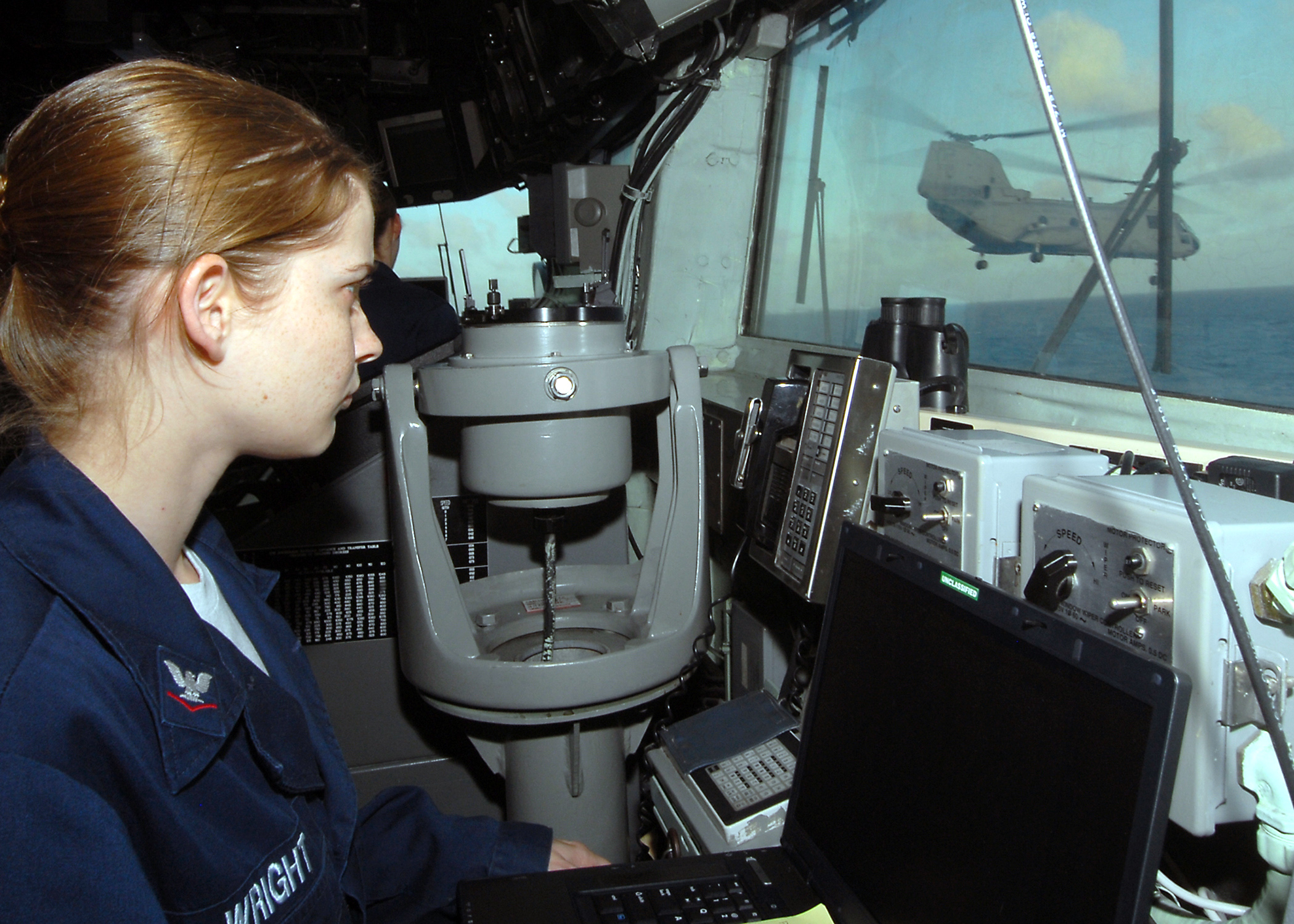 US Navy 070427-N-5567K-015 Electronics Technician 3rd Class Kristy Wright, a native of Woodsboro, Texas, checks figures on USS Bonhomme Richard (LHD 6) Global Positioning System